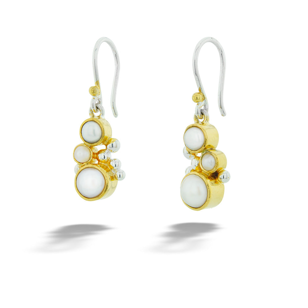 Gold and silver earrings with white stones on a white background 22K Gold Vermeil Pearl Earrings by Michou