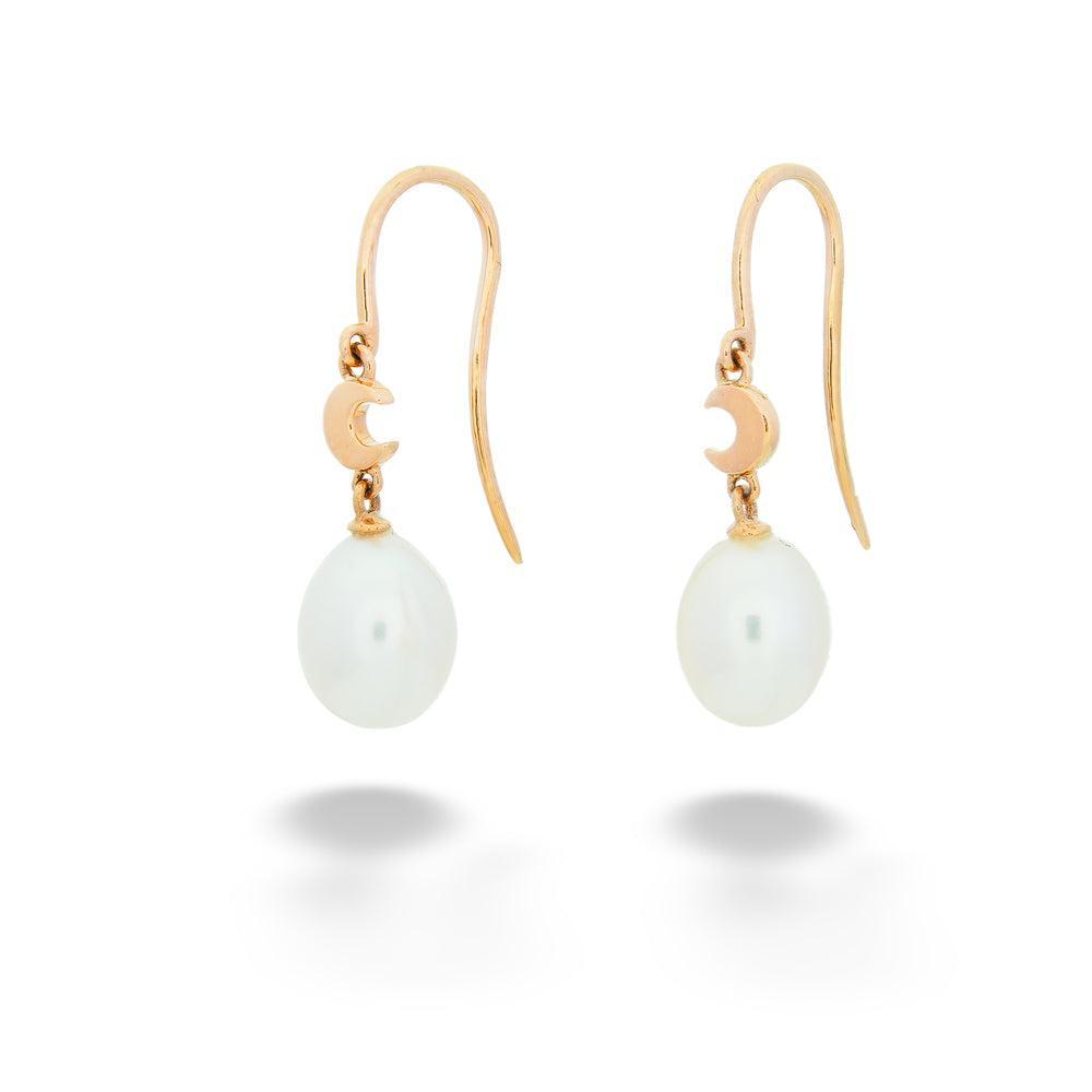 Gold earrings with white pearls on a white background Crescent Moon Pearl Dangle Earrings 