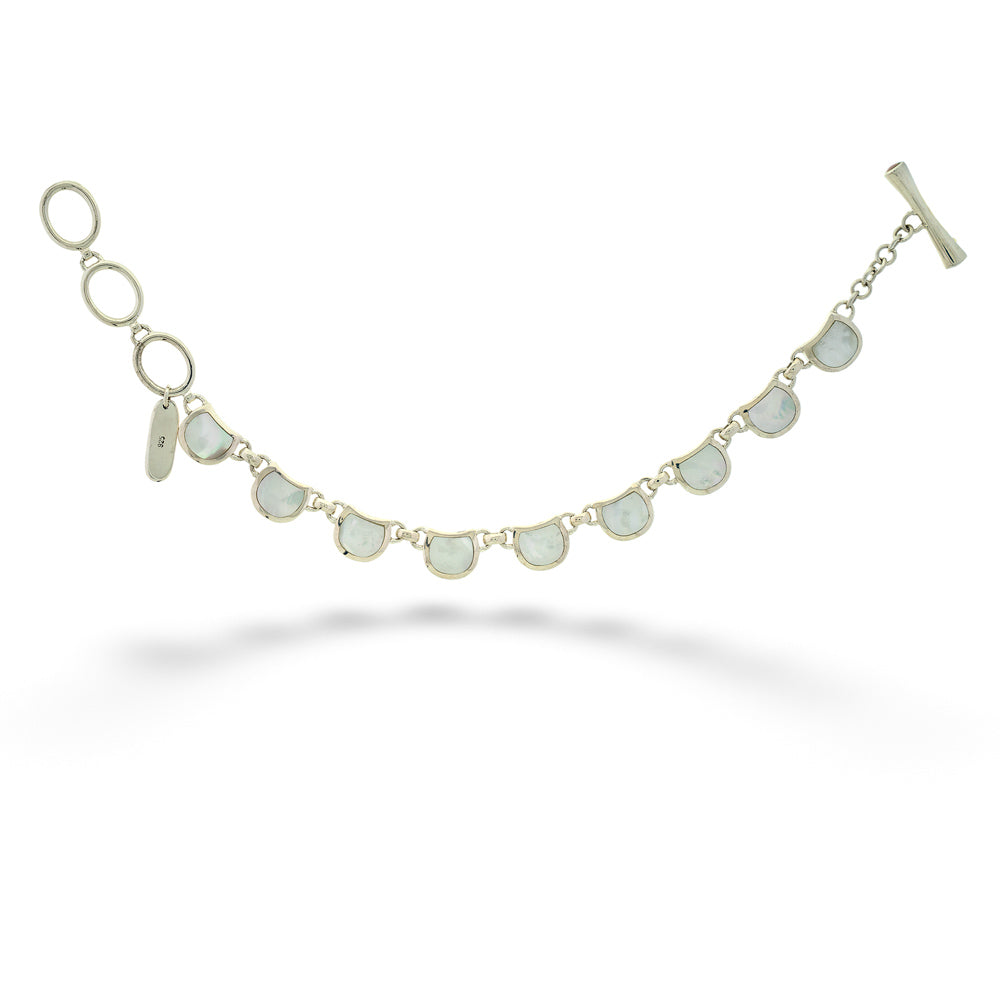 Bracelet with circular charms on a white background Mother of Pearl Reversible Bracelet by Acleoni
