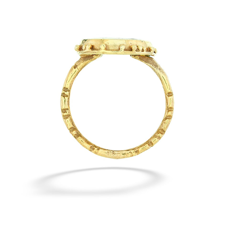 Gold ring with a textured band on a white background Enameled Jester Ring by Katrin Wolf