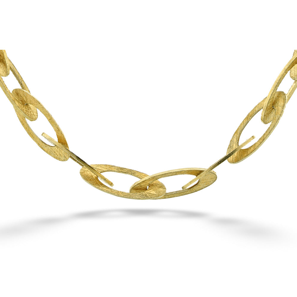 Gold chain necklace on a white background Marquise Link Bracelet by Mysterium - 8"