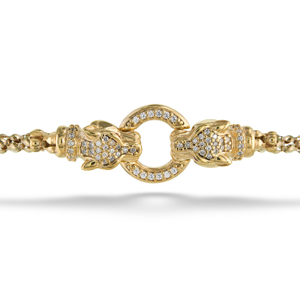 Gold bracelet with intricate design on a white background Double Lioness Bracelet by Miss Mimi