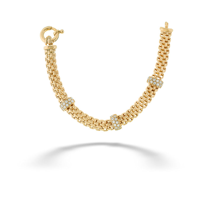 Gold chain necklace with embedded stones on a white background 3-Bar Oro Link Bracelet by Miss Mimi