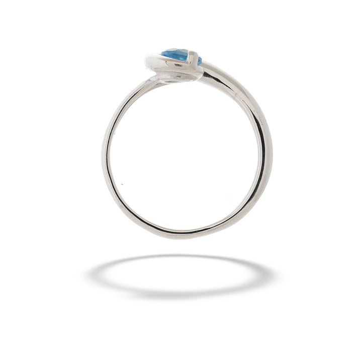 Silver ring with a blue gemstone on a white background Blue Topaz Elegance Ring by E.L. Designs