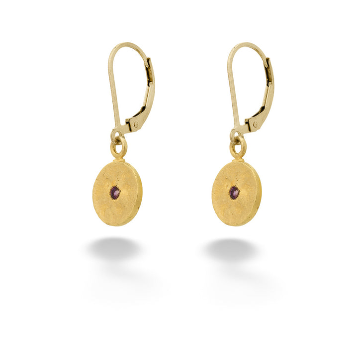 Gold earrings with round disc designs and purple gemstones on a white background Rhodolite Garnet Disc Earrings by Anatoli