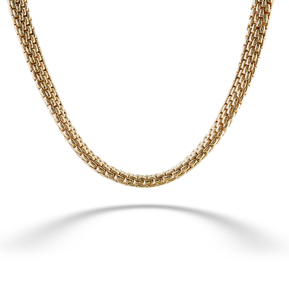 Gold chain necklace on a white background Oro Link Necklace by Miss Mimi 