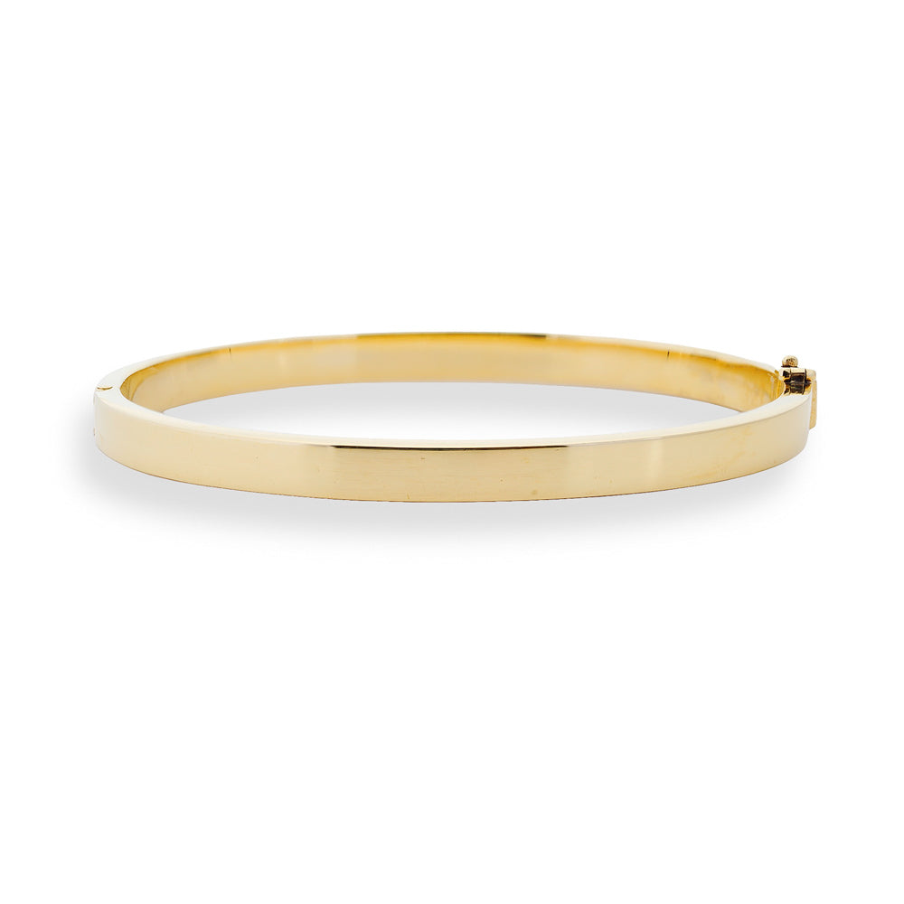 Gold bangle on a white background 18K Gold Hinged Bangle Bracelet