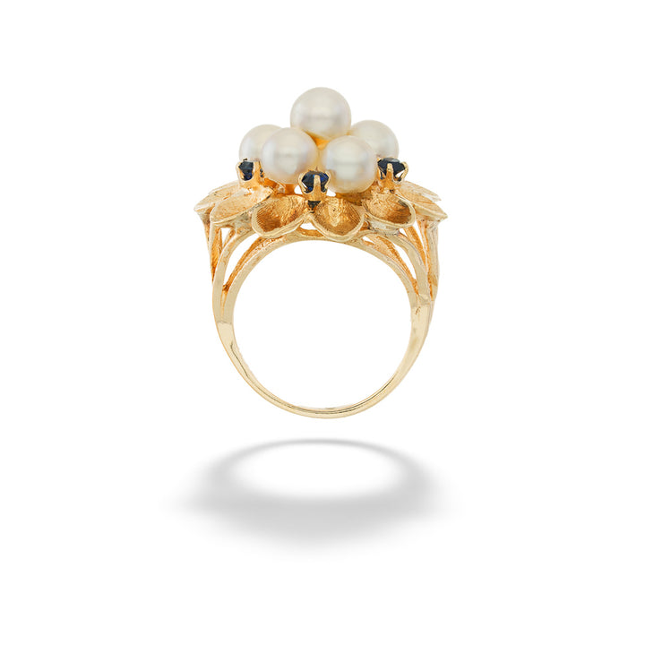 Gold ring with pearls on a white background Akoya Pearl Flower Ring