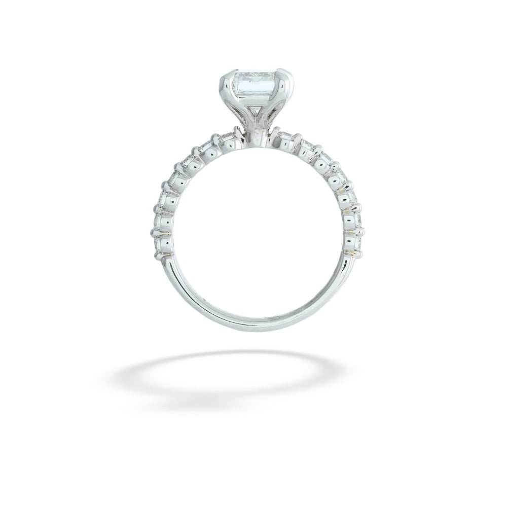 Diamond ring with a central gemstone and smaller stones on a white background Emerald-Cut Lab Grown Diamond Ring