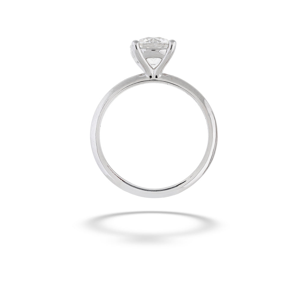 Silver ring with a diamond on a white background  14K White Gold Round Diamond Solitaire Engagement Ring by Valina 