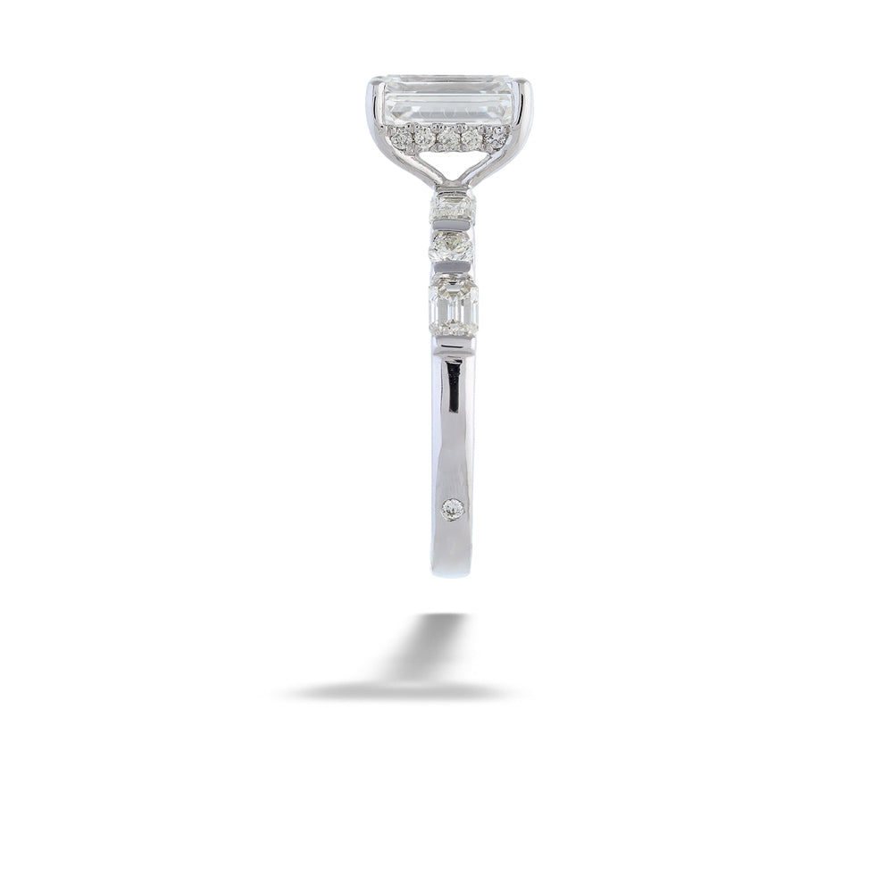 Diamond ring with a unique design on a white background Emerald-cut Diamond Engagement Ring with Diamond Band by Valina