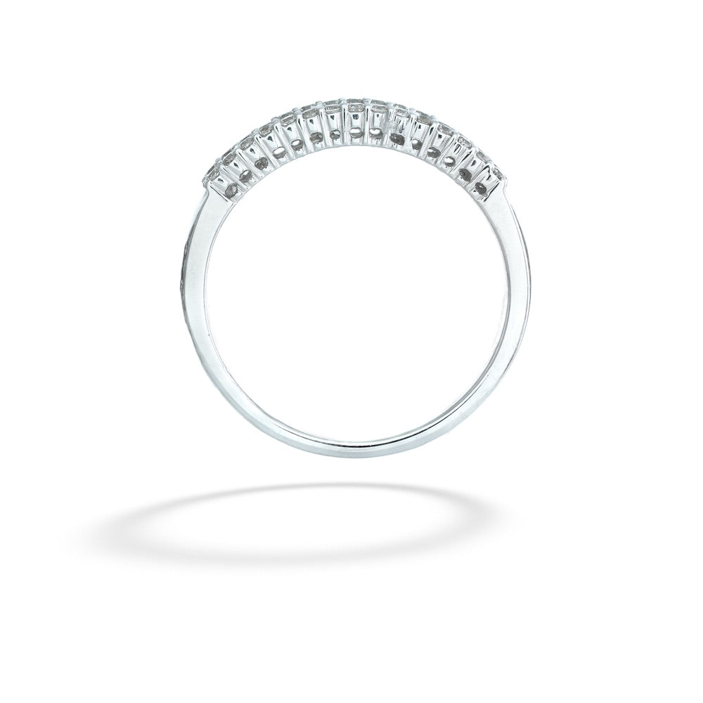 Silver ring with small diamonds on a white background Emerald and Round Cut Diamond Band