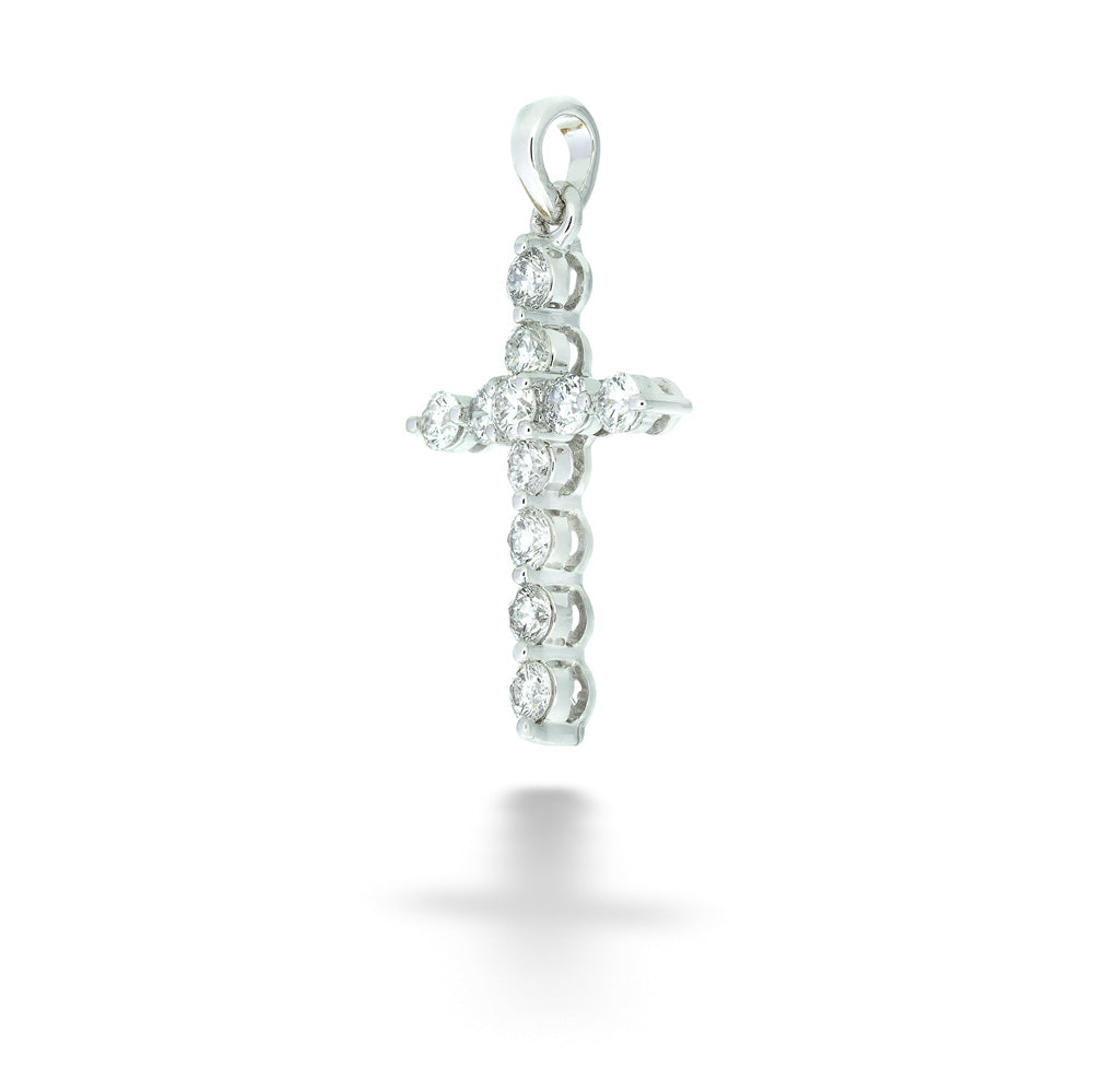 Silver cross pendant with clear stones on a white background 14K White Gold Diamond Cross Pendant