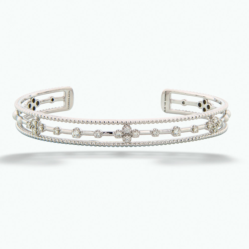 Silver bracelet with floral design on a white background 14K White Gold Diamond Cuff by Gabriel & Co.