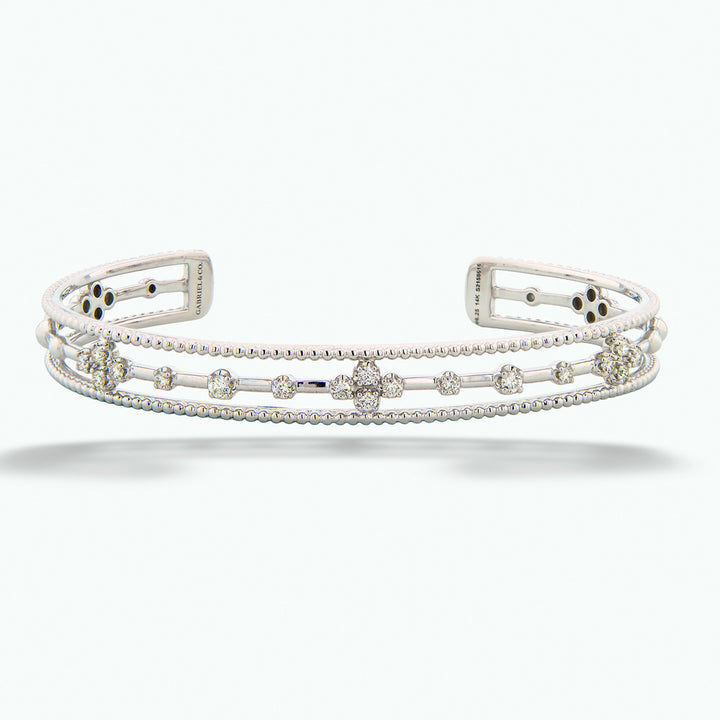 Silver bracelet with floral design on a white background 14K White Gold Diamond Cuff by Gabriel & Co.