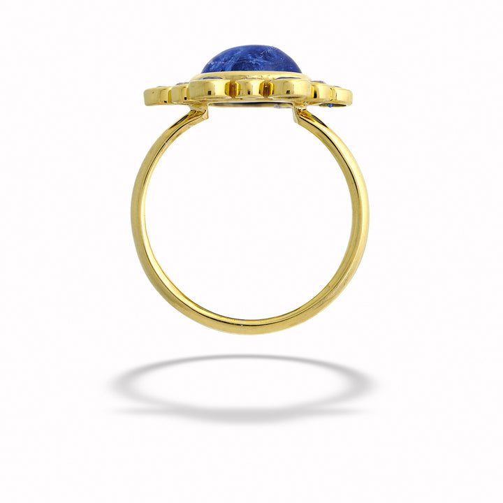 Gold ring with a blue gemstone on a white background Tanzanite, Sapphire, and Diamond Ring by Mazza