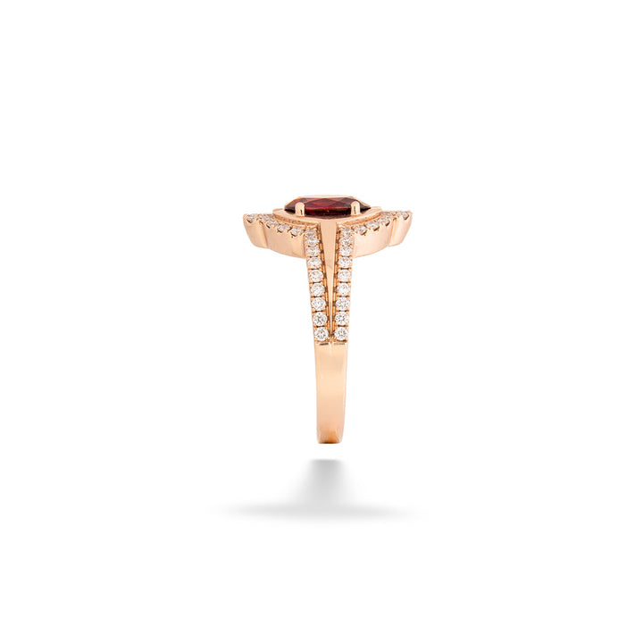Rose gold ring with a red gemstone and diamond accents on a white  Red Spinel Rose Gold Ring background