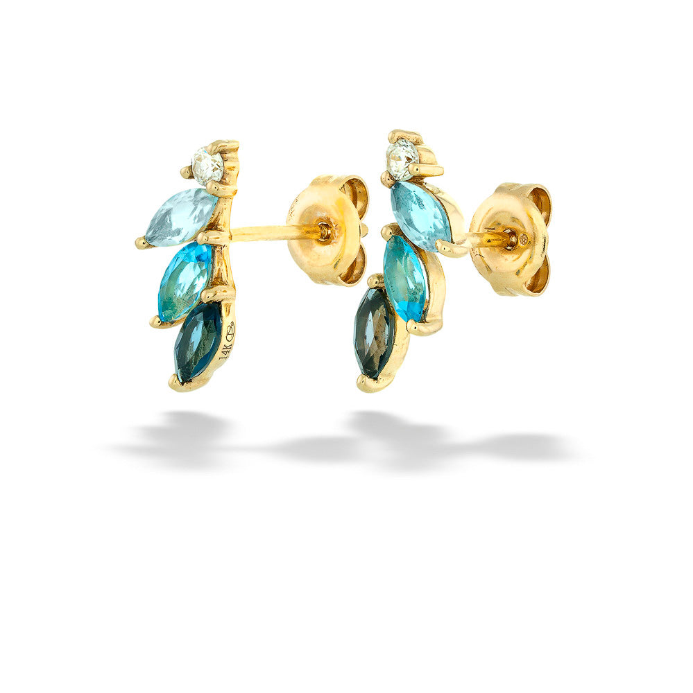 Gold earrings with blue gemstones on a white background Blue Topaz and Diamond Earrings