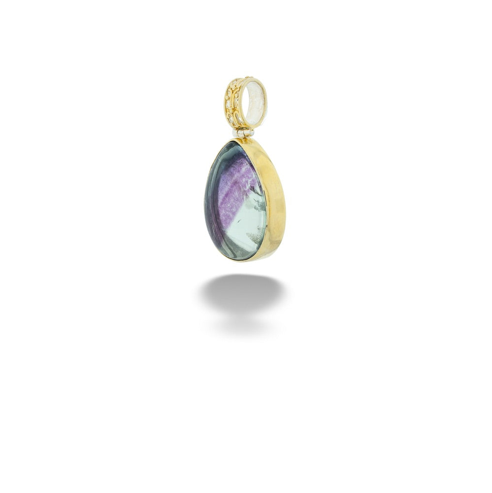 Gold pendant with a purple gemstone on a white background Fluorite Pendant by Michou