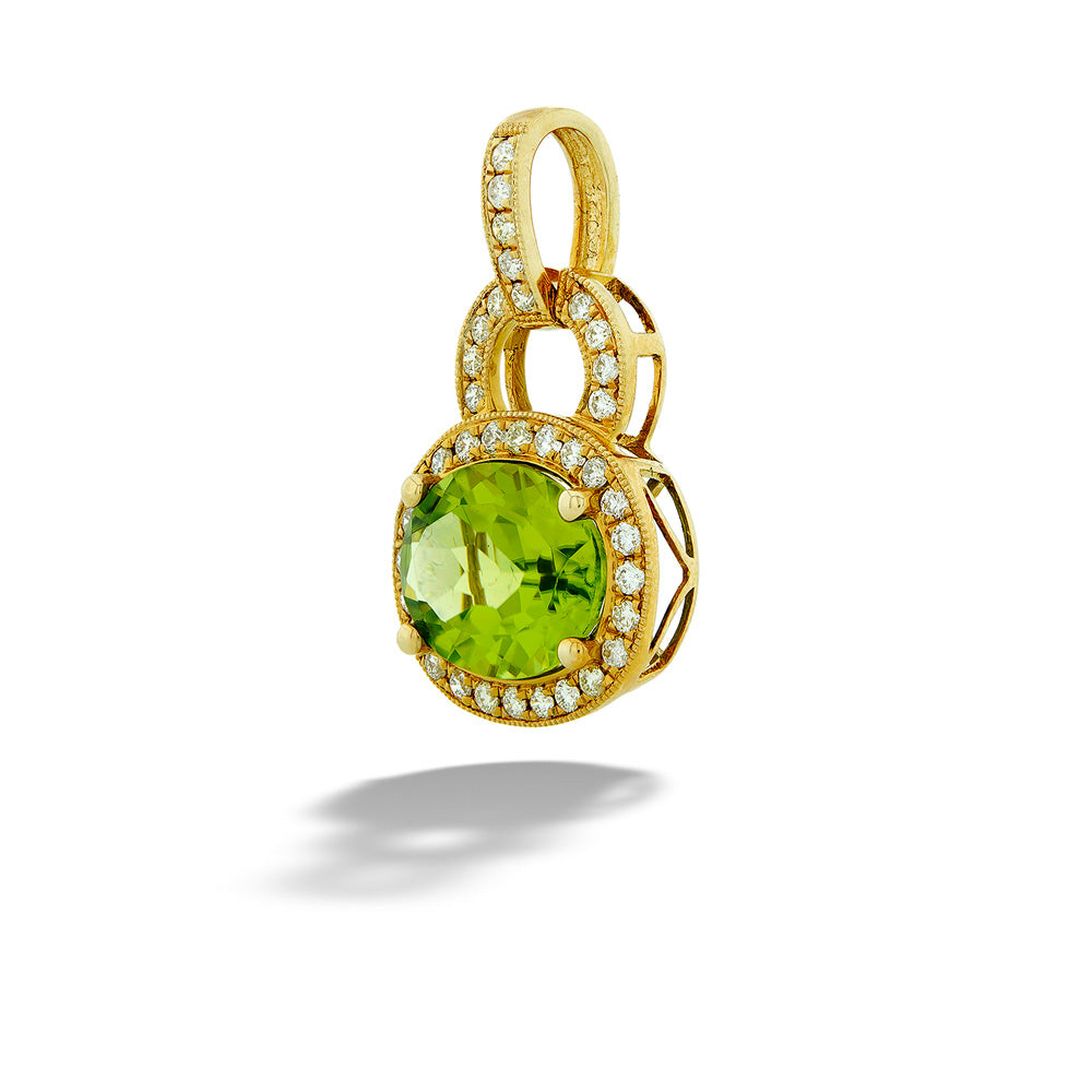 Gold pendant with a green gemstone on a white background Oval Peridot and Diamond Halo Pendant