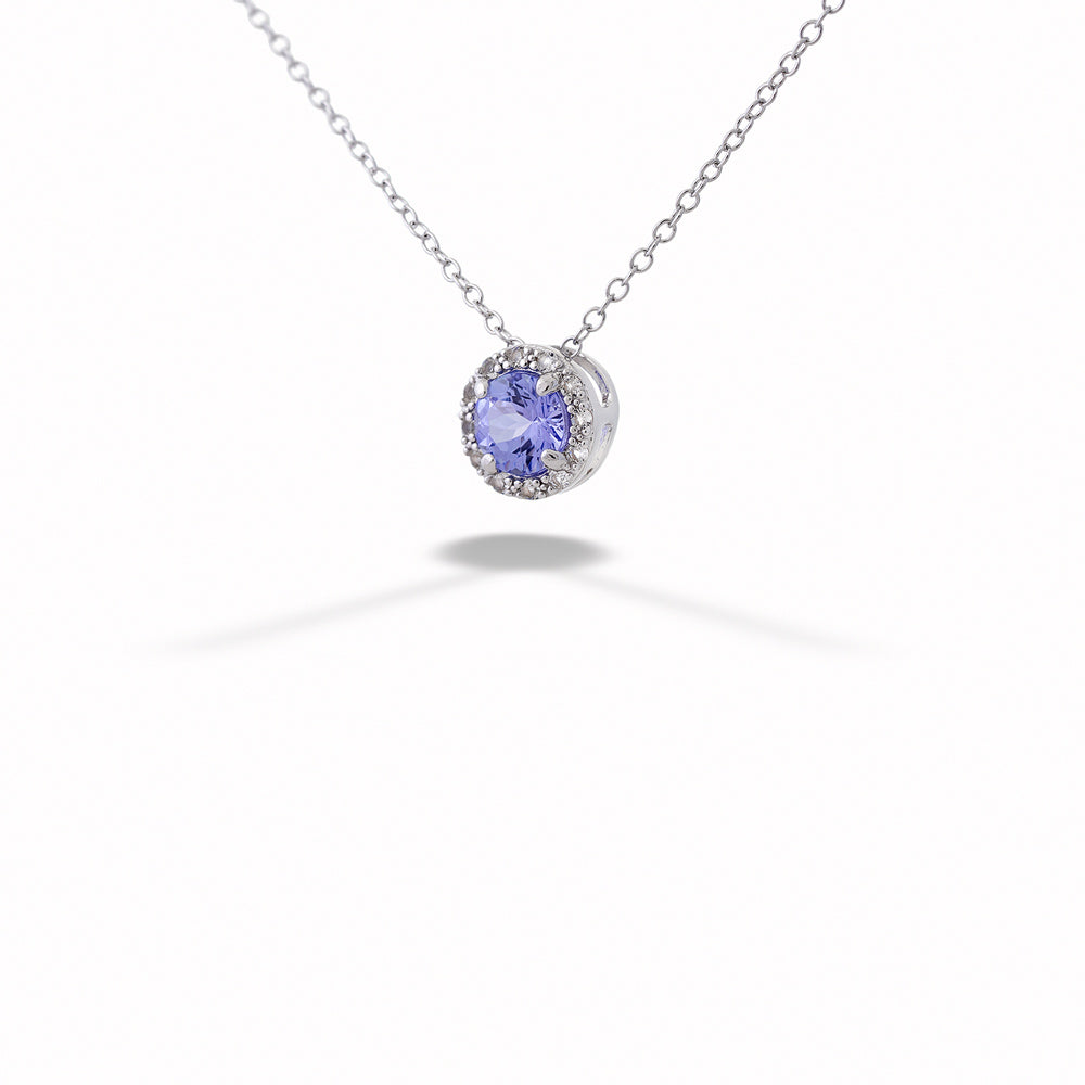 Necklace with a purple gemstone pendant on a white background Tanzanite Halo Pendant Necklace by Samuel B. 