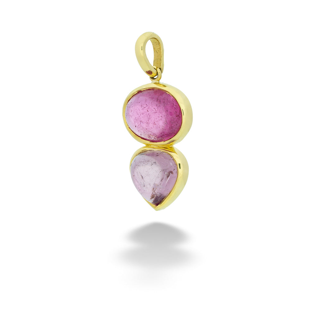Gold pendant with pink gemstones on a white background Two-Tone Pink Tourmaline Pendant by Lauren K.