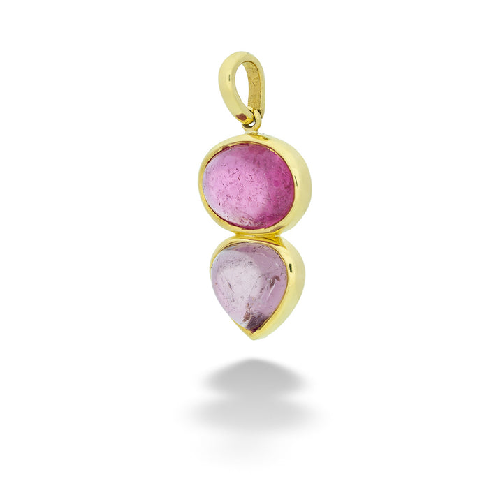 Gold pendant with pink gemstones on a white background Two-Tone Pink Tourmaline Pendant by Lauren K.