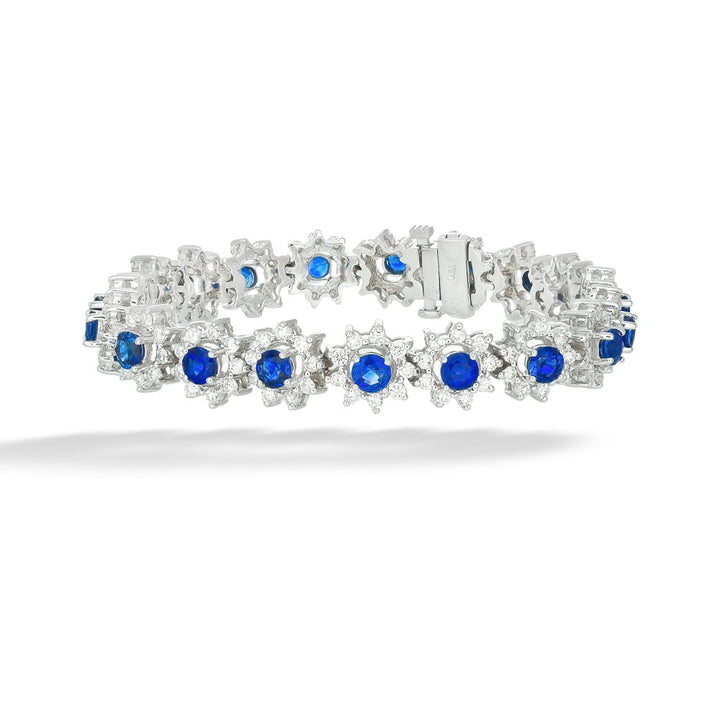 Silver bracelet with blue gemstones on a white background Blue Sapphires with Diamond Halos Bracelet