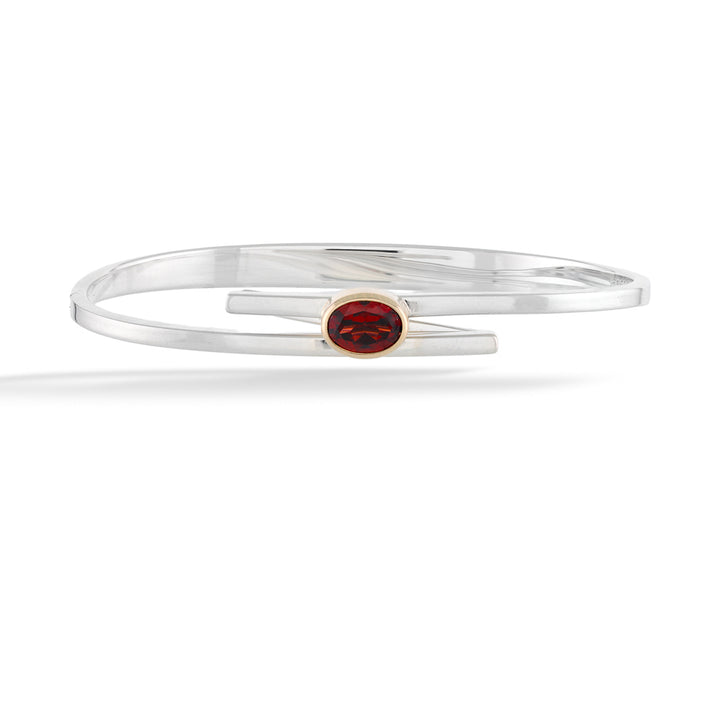 Silver bracelet with a red gemstone on a white background Garnet Urban Swing Bracelet by E.L. Designs