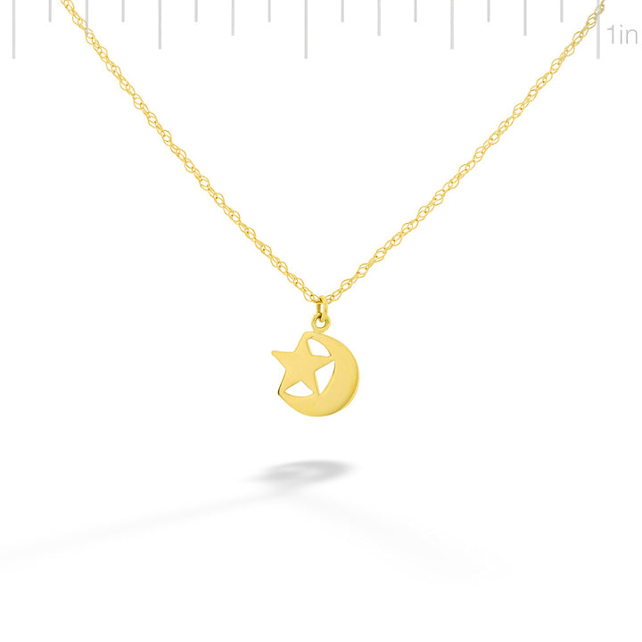 Gold necklace with a star pendant on a white background Gold Star and Moon Pendant Necklace