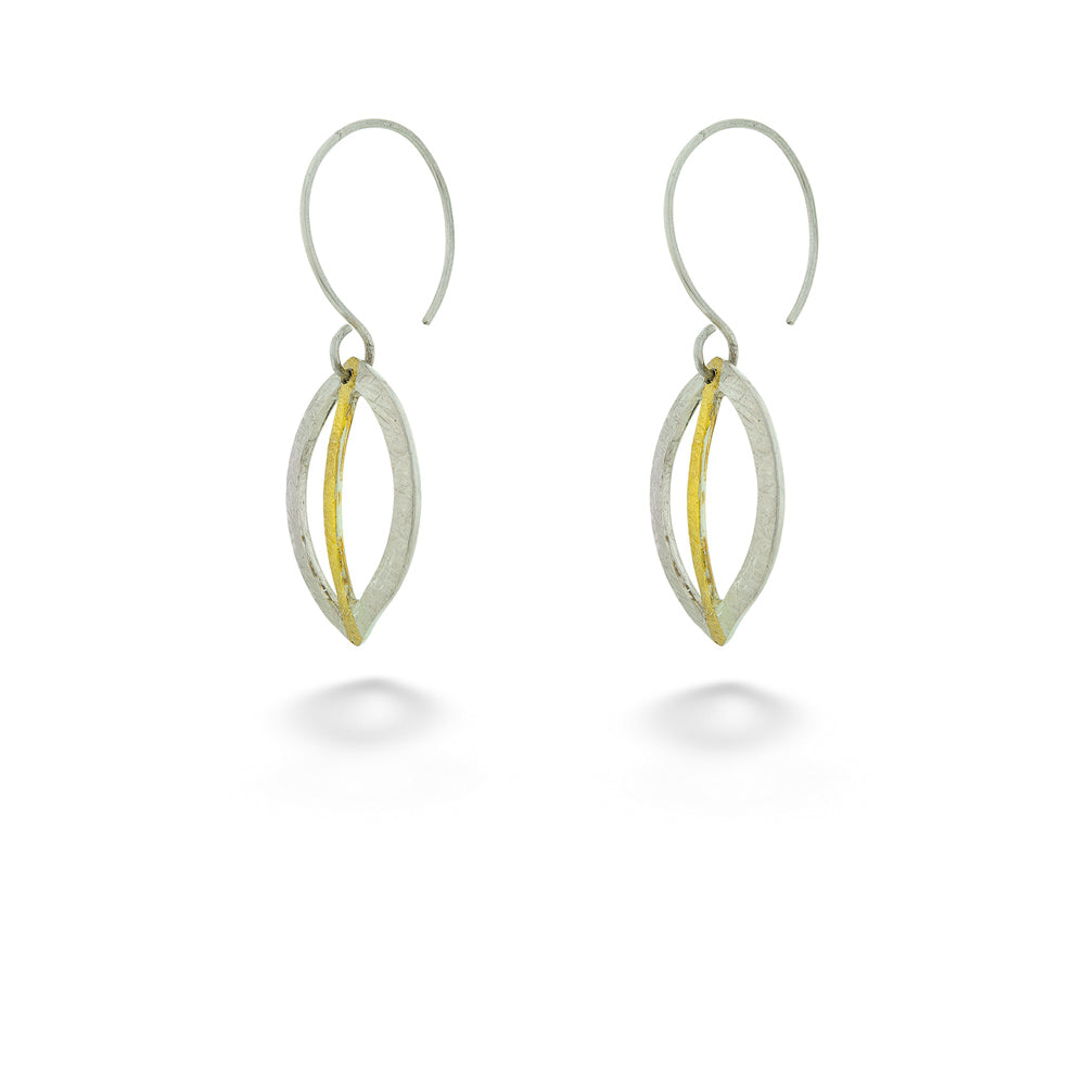 Pair of silver and gold earrings on a white background Hollow Leaf Earrings by Melanie Considine