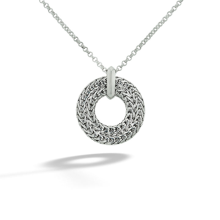 Silver braided necklace on a white background  Icon Link Round Pendant Necklace by John Hardy 