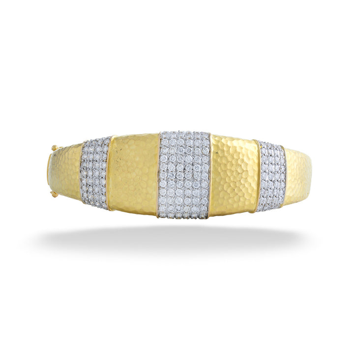 Gold and silver bracelet on a white background 18K Gold Diamond Bangle