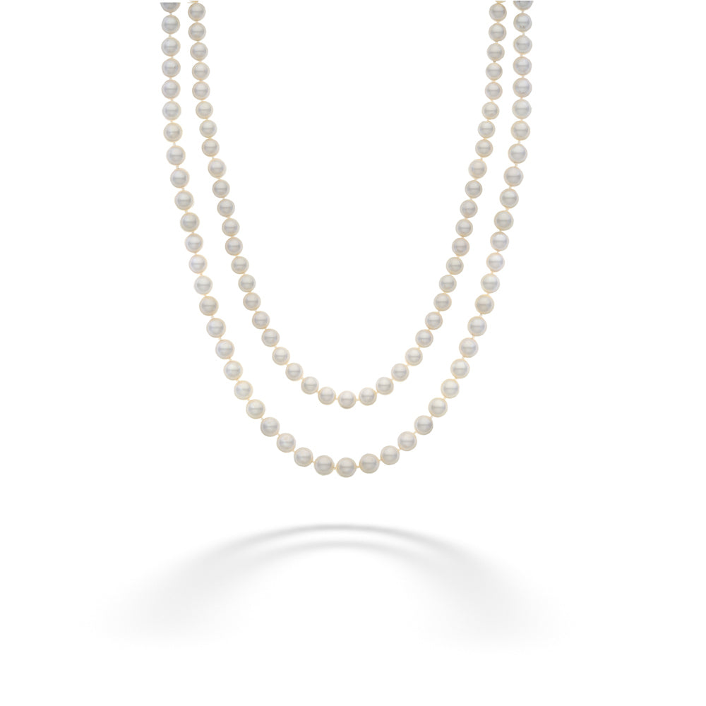 Two strands of pearls on a white background Akoya Pearl Double Strand Necklace with Diamond Flower Clasp