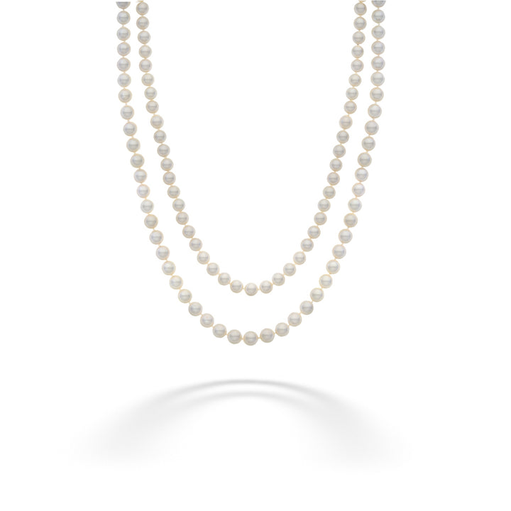 Two strands of pearls on a white background Akoya Pearl Double Strand Necklace with Diamond Flower Clasp