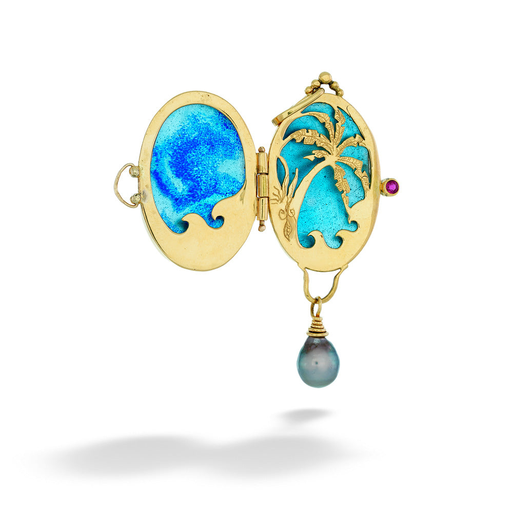 Gold locket with blue enamel design and pearl pendant on a white  Love in Paradise Enamel Locket by Katrin Wolf background